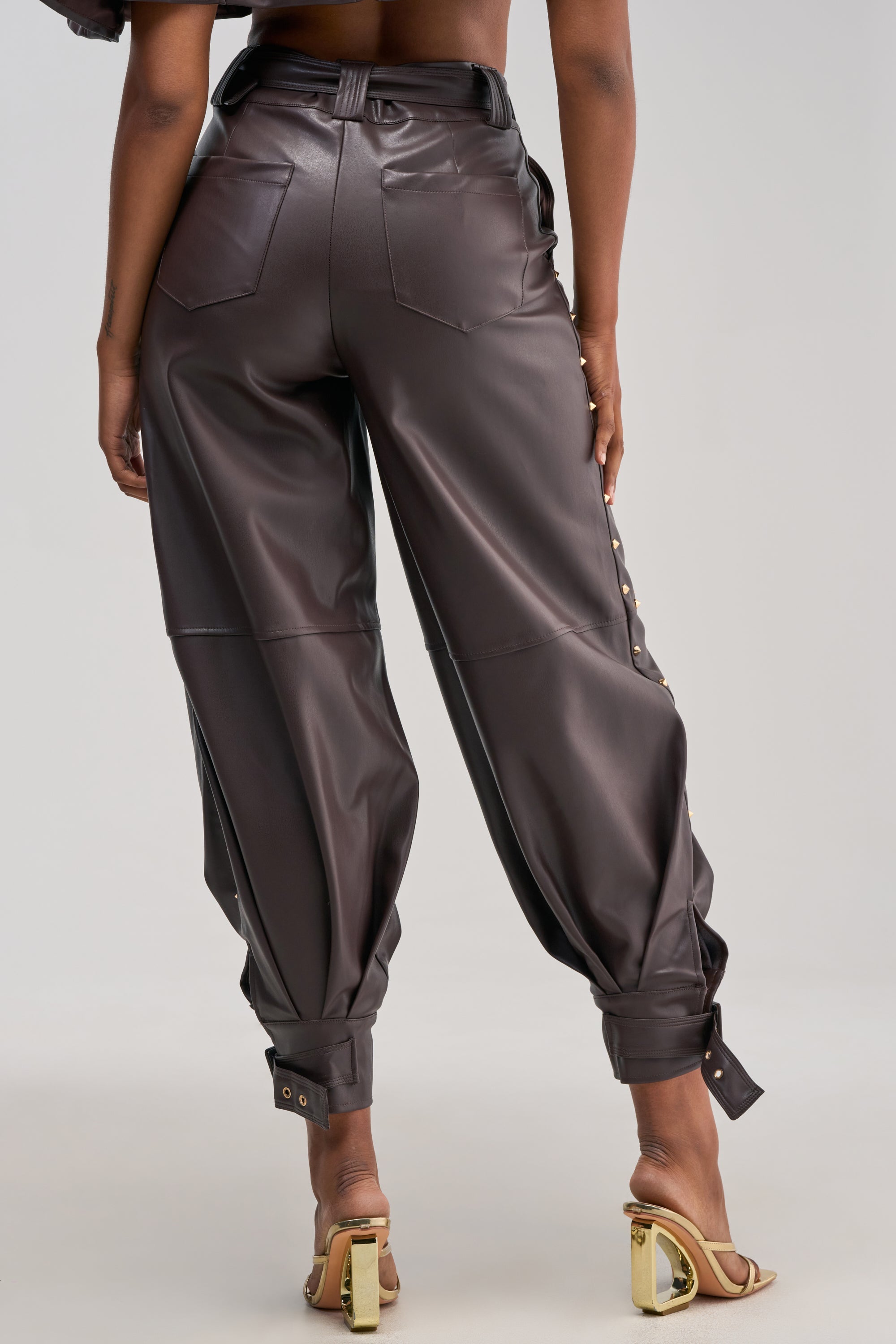 STUDDED FAUX LEATHER BELTED PANT IN DARK CHOCOLATE
