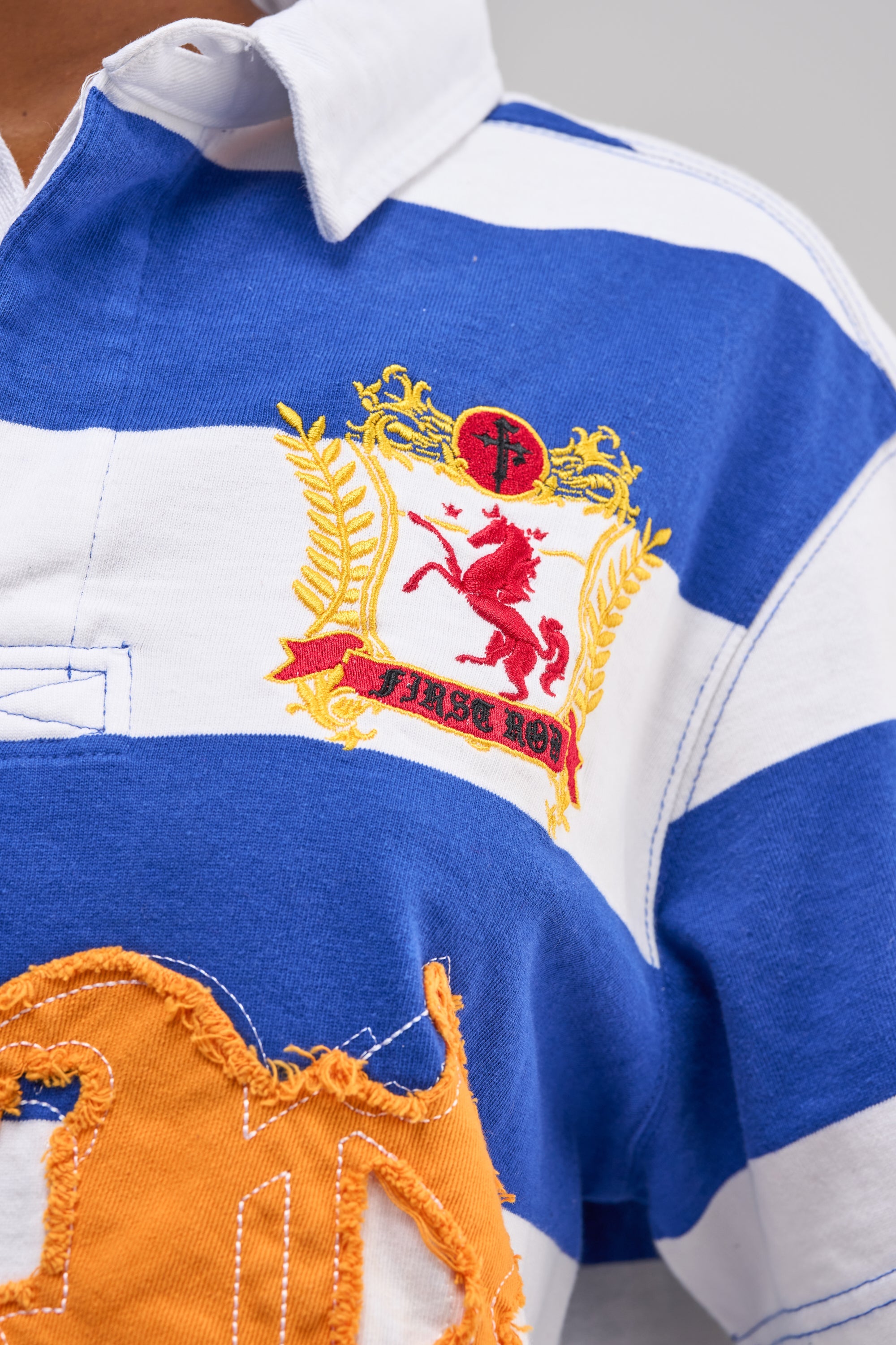 FIRST ROW ICON STATUS CROPPED STRIPED POLO