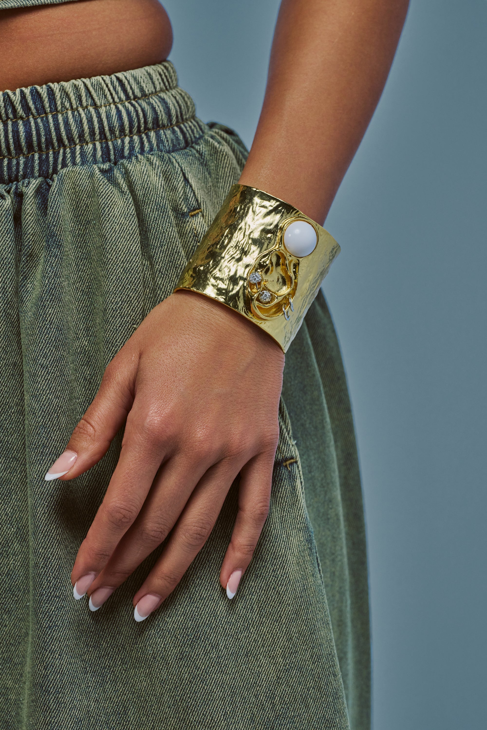 LISTEN CLOSELY METAL CUFF IN GOLD